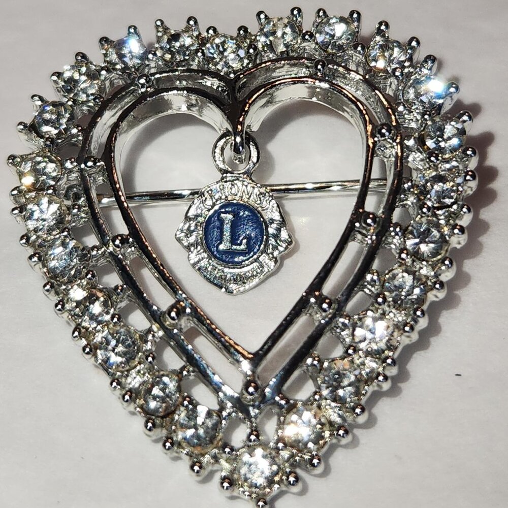 Lion's Club Valentine's Day pin with rhinestones and lion's club logo charm in t